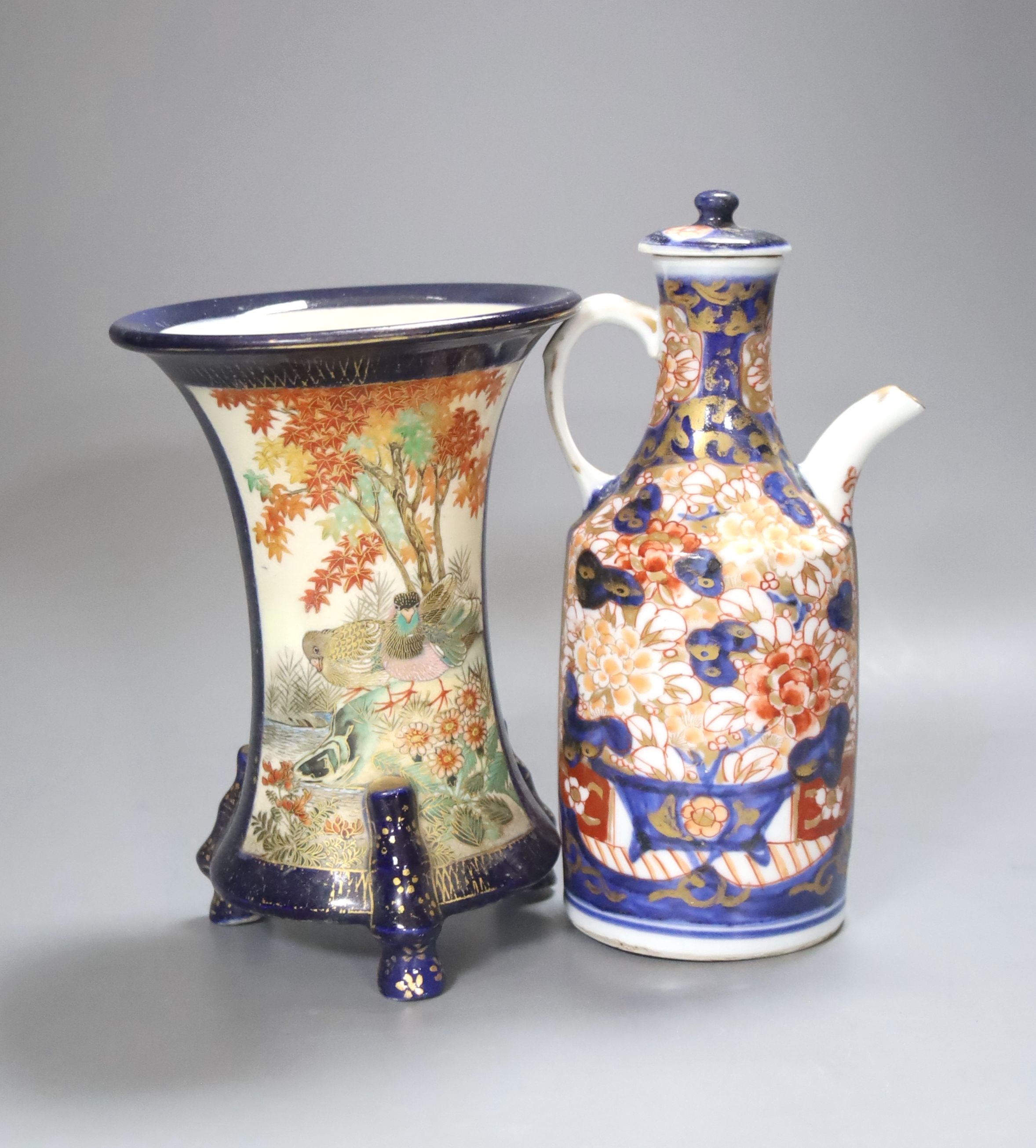 A Japanese Imari sake jug and a Satsuma pottery blue ground vase, tallest 18cm